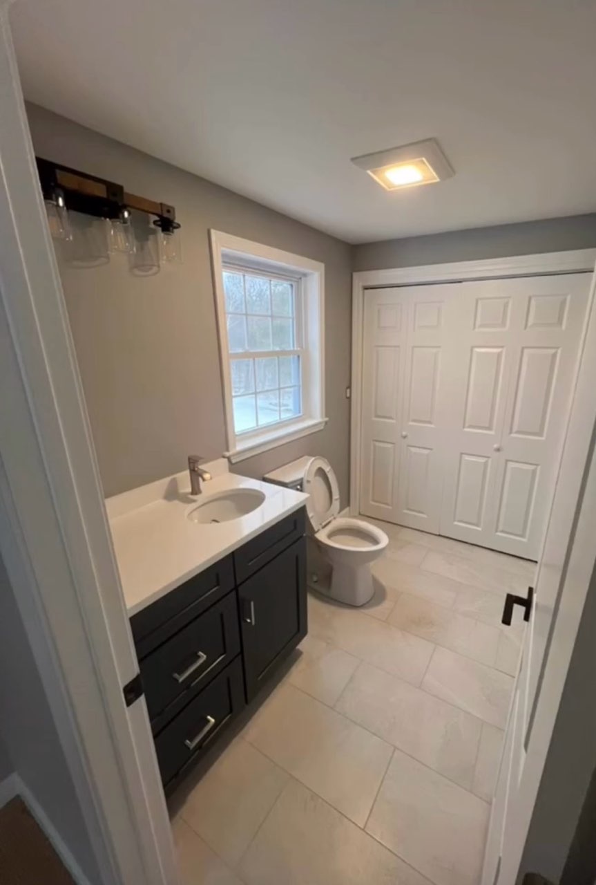 Finished bathroom walls, trim, and doors